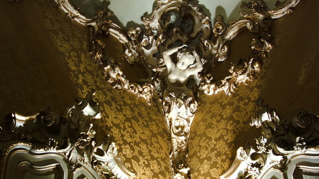 Ornate interior design with female bust