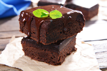 Delicious chocolate cakes on table close-up