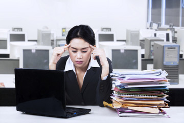 Fototapeta premium Young businesswoman looking tired