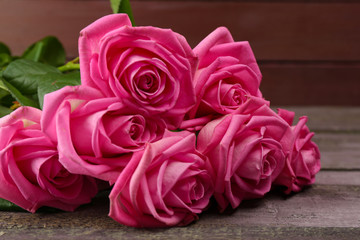 Beautiful pink roses on table close up