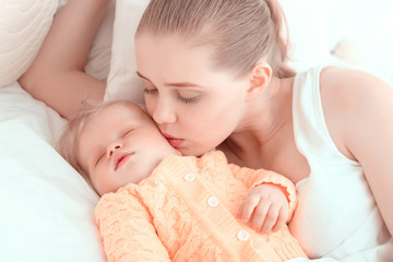 Sleeping baby and his mother