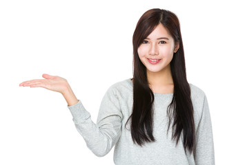 Asian woman with hand showing something