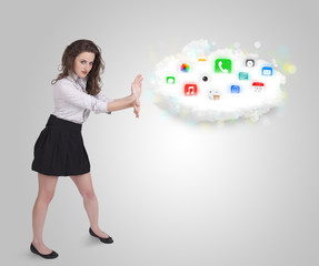 Young woman presenting cloud with colorful app icons and symbols