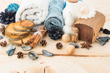 spa stuff, cinnamonand flower with towel on wood