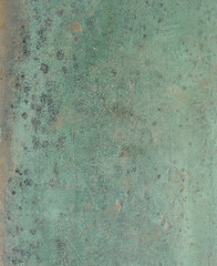 grunge bronze surface in black blue green