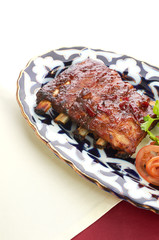 Meat on a grill with vegetables