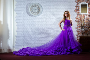 Lady in a luxury, long purple dress