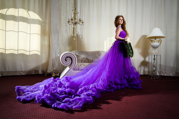 The girl in a luxury, long purple dress