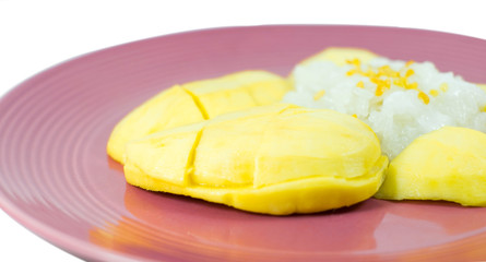 Thai style tropical dessert, glutinous rice eat with mangoes, is