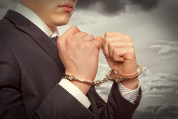 Businessman in handcuffs