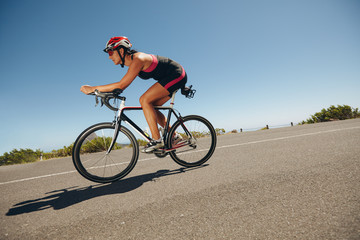 Female cyclist on a country road