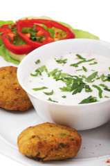 Indian food: yogurt salad and vegetable pies.