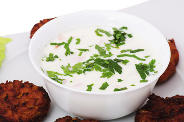 Indian food: yogurt salad and vegetable pies.