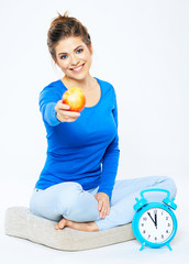 Portrait of young woman with red apple.