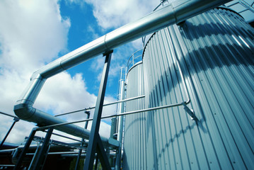 Industrial zone, Steel pipelines and valves against blue sky