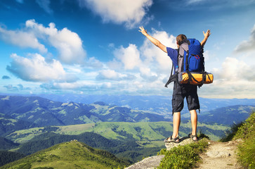 Tourist on mountain peak. Active life concept..