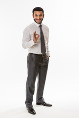 Handsome man shows OK.