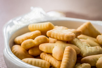 Close up biscuit alphabet in little cup