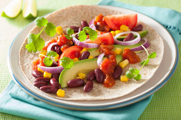 vegan taco with vegetable, kidney beans and salsa
