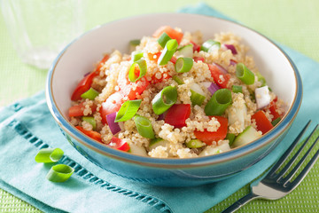 healthy couscous salad with tomato cucumber onion chives