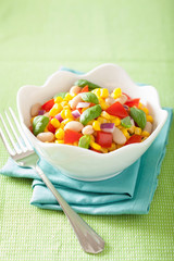 healthy corn salad with tomato onion white bean basil