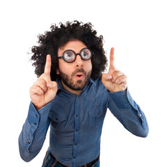 Funny man pointing with the fingers an empty space