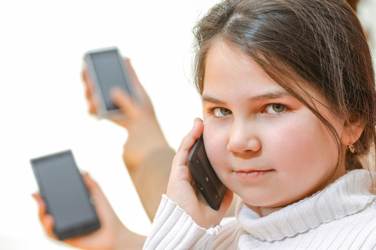 Little girl talking on mobile smartphone