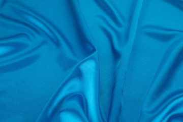 Blue silk background. Texture.