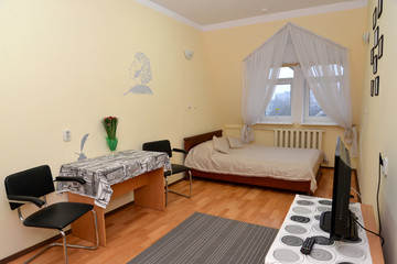 Single hotel room with a portrait of the Russian poet A.S. Pushk