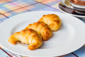 Breakfast with fresh delicious croissants.