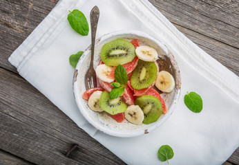 Fresh fruit salad with kiwi, grapefruit and banana