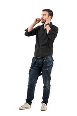 Cool young fashion model adjusting his mustaches