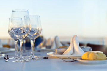 Dinner plate in restaurant with wine glasses