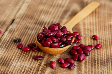 raw dried beans on a wooden surface