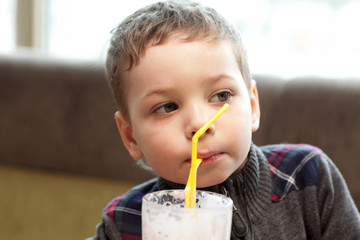 Child drinking milkshake