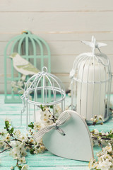 Obraz premium Postcard with flowering tree branches, heart and decorative bird