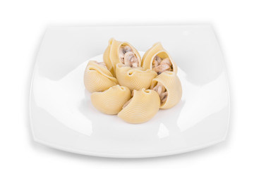 Pasta shells on stuffed with mushrooms.