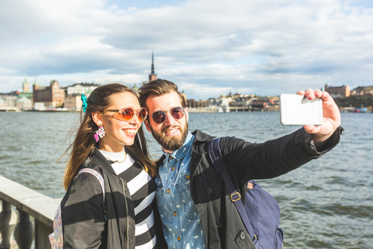 Young hipster couple taking a selfie in Stockholm