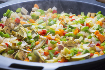 Cooking Mediterranean vegetables on a pan