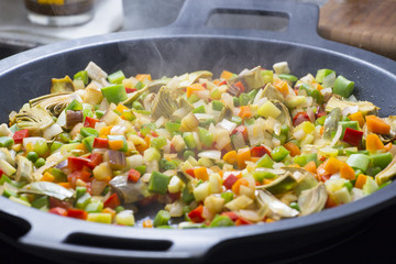 Cooking Mediterranean vegetables on a pan