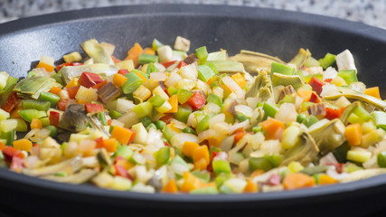 Cooking Mediterranean vegetables on a pan