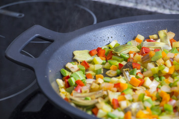 Cooking Mediterranean vegetables on a pan