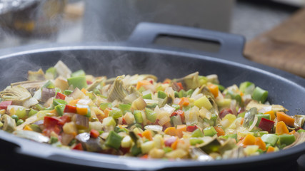 Cooking Mediterranean vegetables on a pan