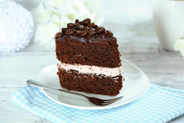 Delicious chocolate cake on table on light background