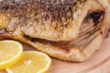 Grilled carp with lemon.
