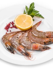 Raw tiger shrimps on plate.