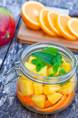 homemade fruit drink with mango orange and mint