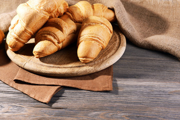 Delicious croissants on table close-up