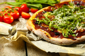 Tasty pizza with vegetables on table close up