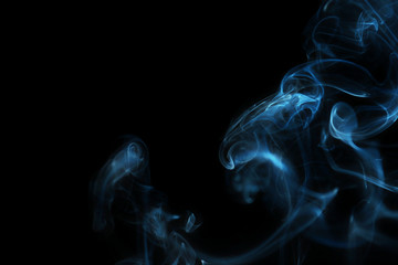 Color smoke from match on dark background
